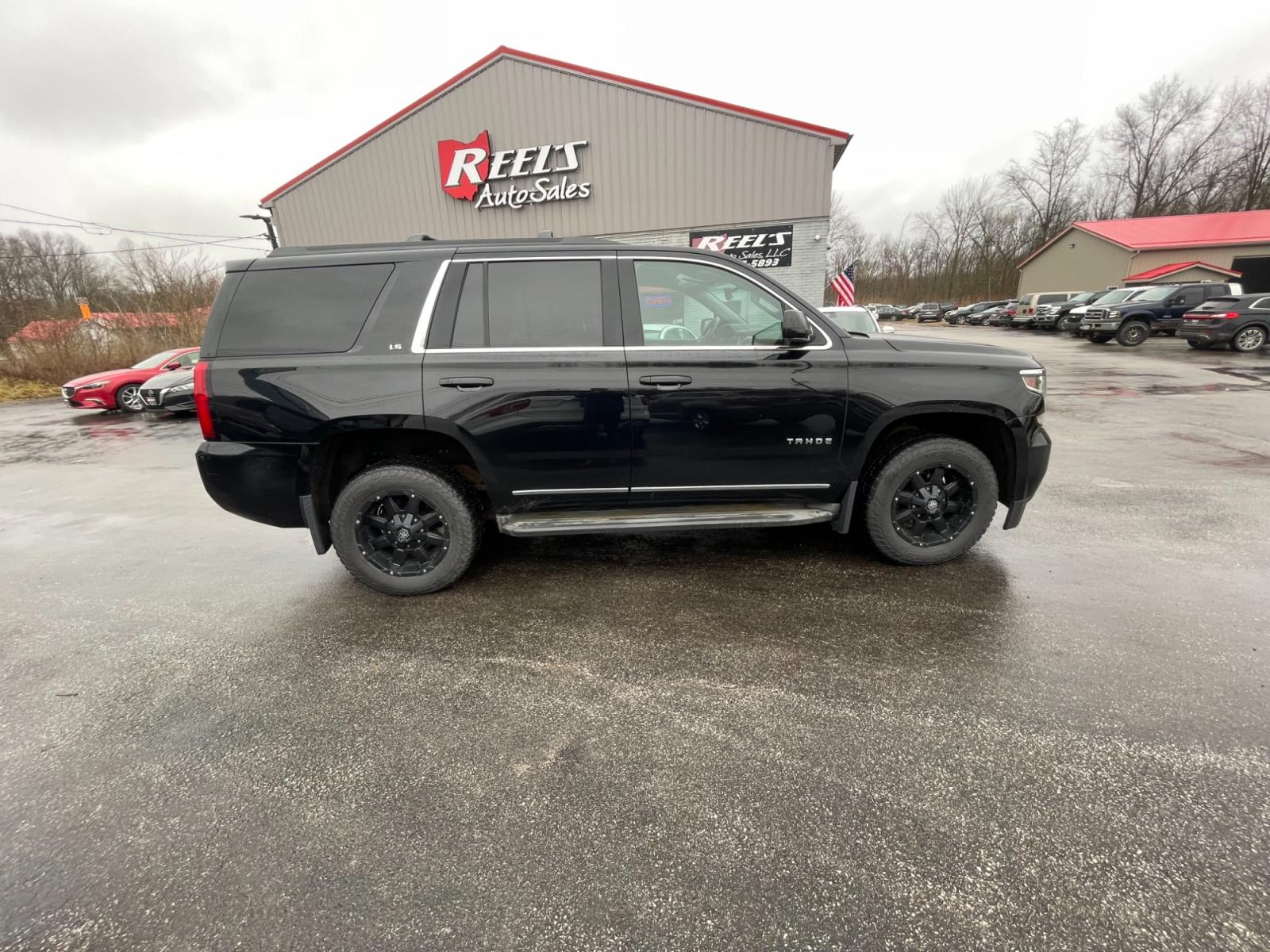 2015 Black /Black Chevrolet Tahoe LS 4WD (1GNSKAEC8FR) with an 5.3L V8 OHV 16V engine, 6-Speed Automatic transmission, located at 547 E. Main St., Orwell, OH, 44076, (440) 437-5893, 41.535435, -80.847855 - This 2015 Chevrolet Tahoe LS 4WD is a versatile and robust full-size SUV that offers a range of comfort and utility features, appealing to families and those needing a capable vehicle for towing and outdoor adventures. Equipped with Tri-Zone Automatic Climate Control, Power Front Seats, and Rain Sen - Photo #6